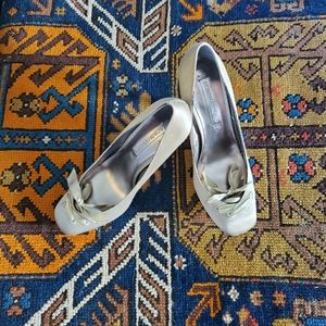 BCBGMAXAZRIA Gold pumps